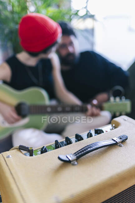 Male and female musicians with musical instruments in studio — Stock Photo