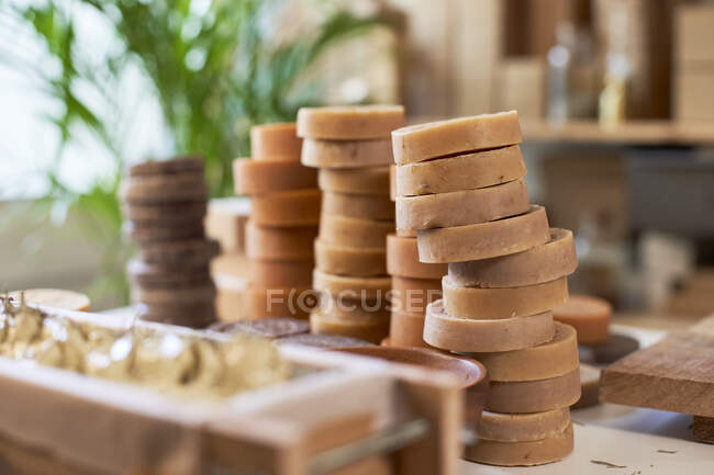 Organic soaps piled up on table at workshop — Stock Photo