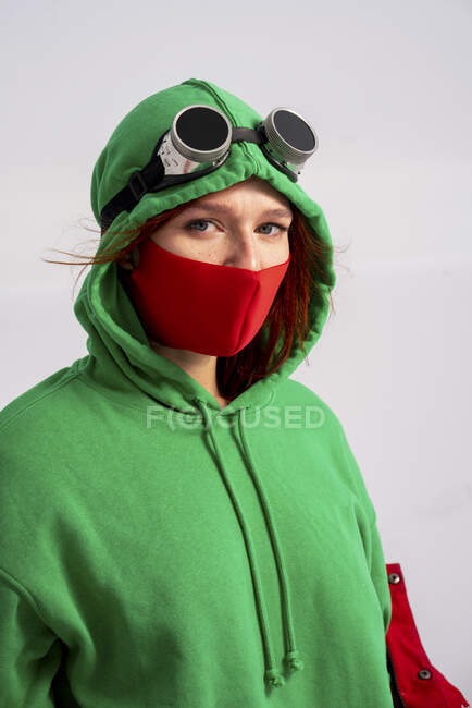 Woman in costume wearing protective face mask during pandemic — Stock Photo