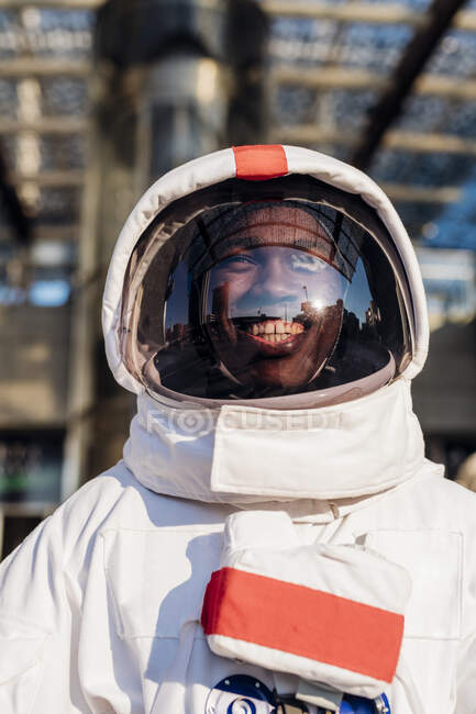 Happy male astronaut with space suit in city — Stock Photo