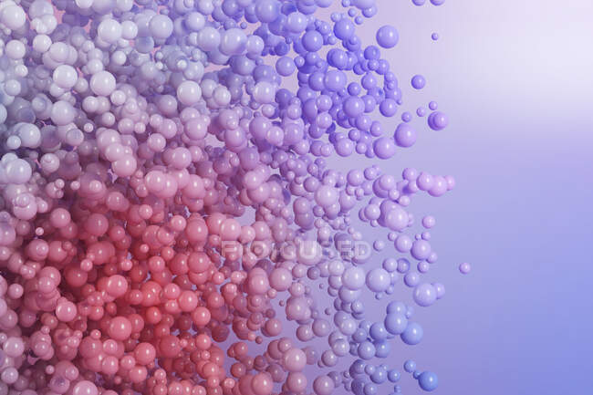 Three dimensional render of purple spheres floating against purple background — Stock Photo