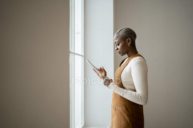 Woman using digital tablet at home — Stock Photo