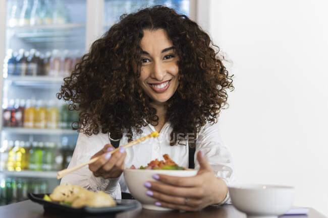 Beautiful woman having food at restaurant — Stock Photo