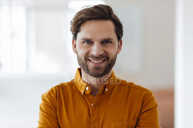 Mature businessman smiling in office — Stock Photo
