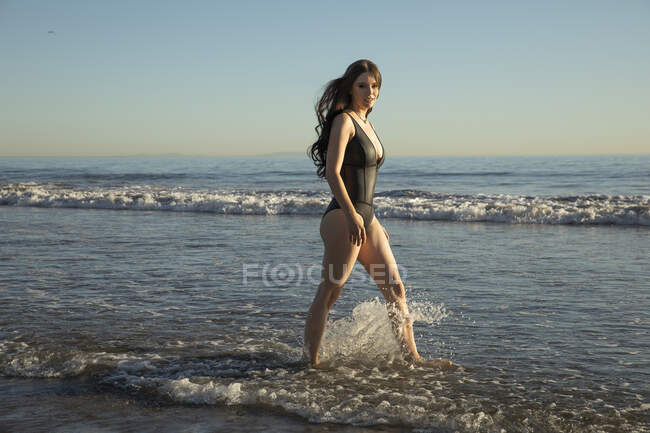 Ebony Beach Nudism - One piece swimsuit - Stock Photos, Royalty Free Images | Focused