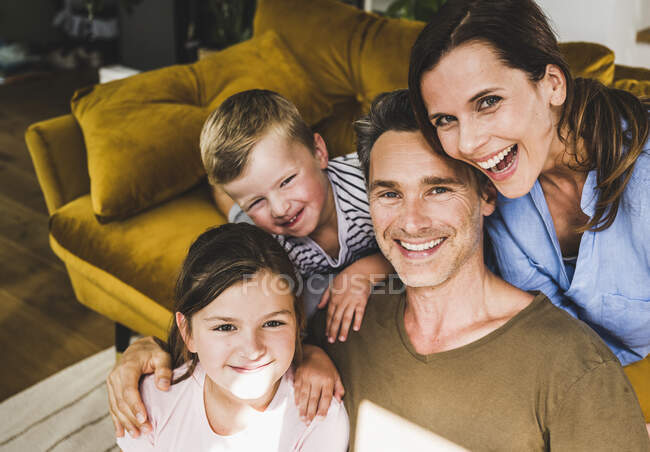 Happy family enjoying leisure time at home — Stock Photo