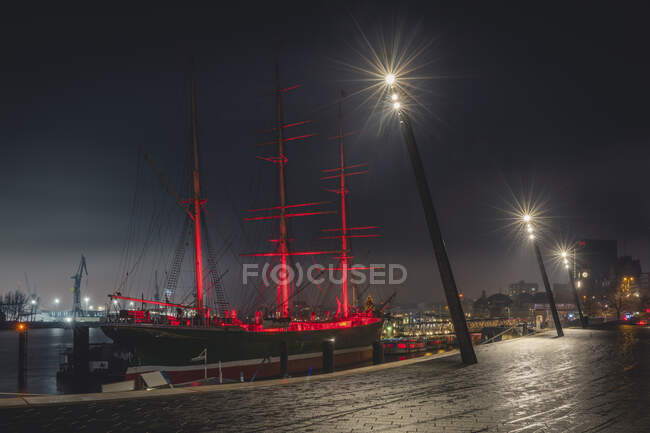 Germany, Hamburg, Museum ship illuminated at night — Stock Photo