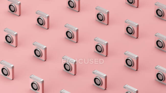 Тривимірний візерунок старомодної камери, що стоїть рядами проти рожевого фону. — стокове фото