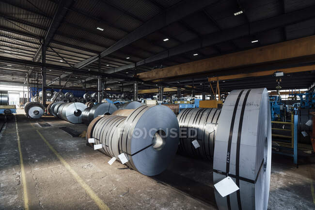 Rolled up metal sheet in steel mill — Stock Photo