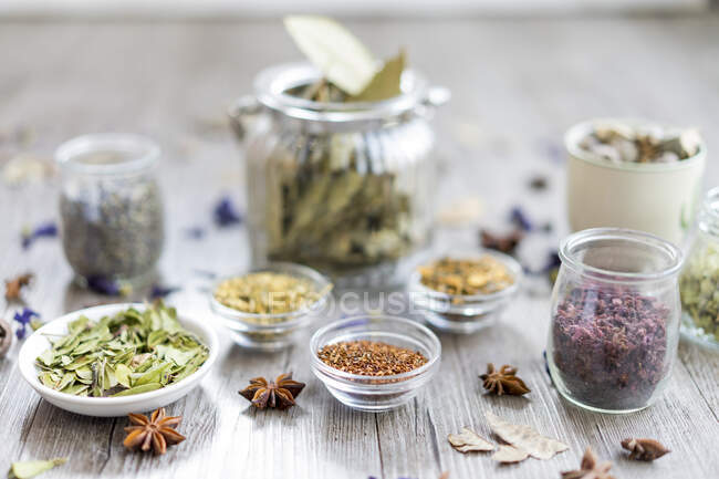 Spices and herbs in jar and bowl — Stock Photo