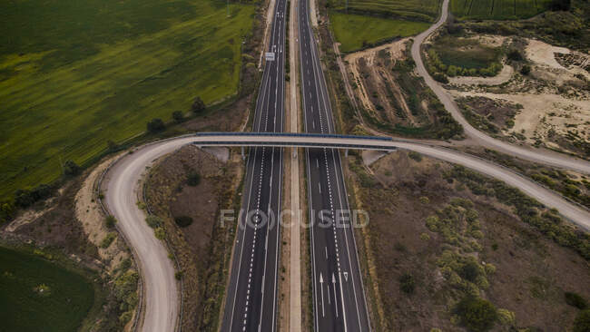 Aerial view of overpass stretching over countryside highway — Stock Photo