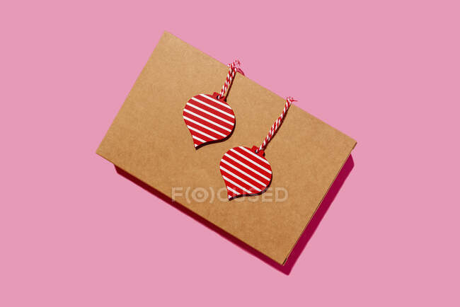 Studio shot of recycled cardboard box with wooden Christmas decorations — Stock Photo