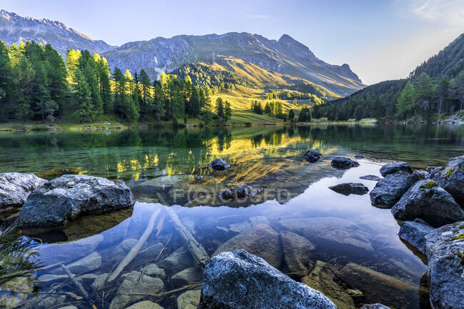 Reflection of mountain in water at Lai Da Palpuogna, Graubunden, Switzerland — Stock Photo