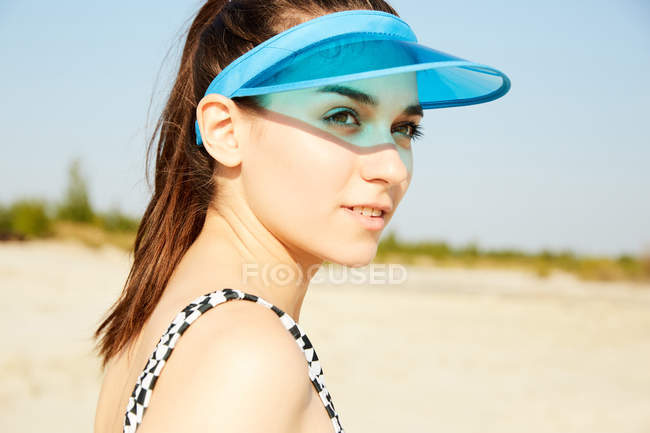 Woman in blue visor — Stock Photo