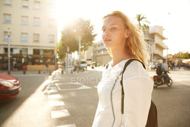 Attractive woman walking with bag on street in barcelona — Stock Photo