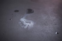 Wet footprint on floor — Stock Photo