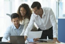 Business professionals reviewing document together. Camaraderie in the office builds morale — Stock Photo
