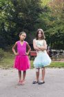 Girls dressed in tutus with tough expression on faces — Stock Photo