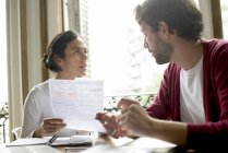Couple discussing family financial issues — Stock Photo