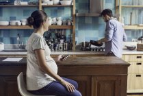 Couple together at home in kitchen — Stock Photo