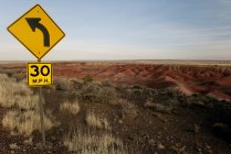 Speed limit sign in desert — Stock Photo