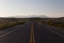 Highway through arid landscape at daytime — Stock Photo