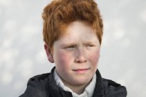 Portrait of boy looking away in thought — Stock Photo