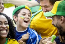 Brazilian football fans celebrating victory at match — Stock Photo