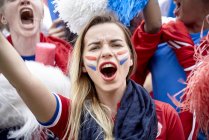 French football fans cheering at match — Stock Photo