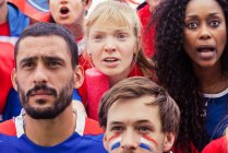 French football fans anxiously watching match — Stock Photo