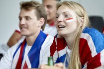 British football fans watching match at home — Stock Photo