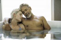 Portrait of Couple soaking in spa — Stock Photo