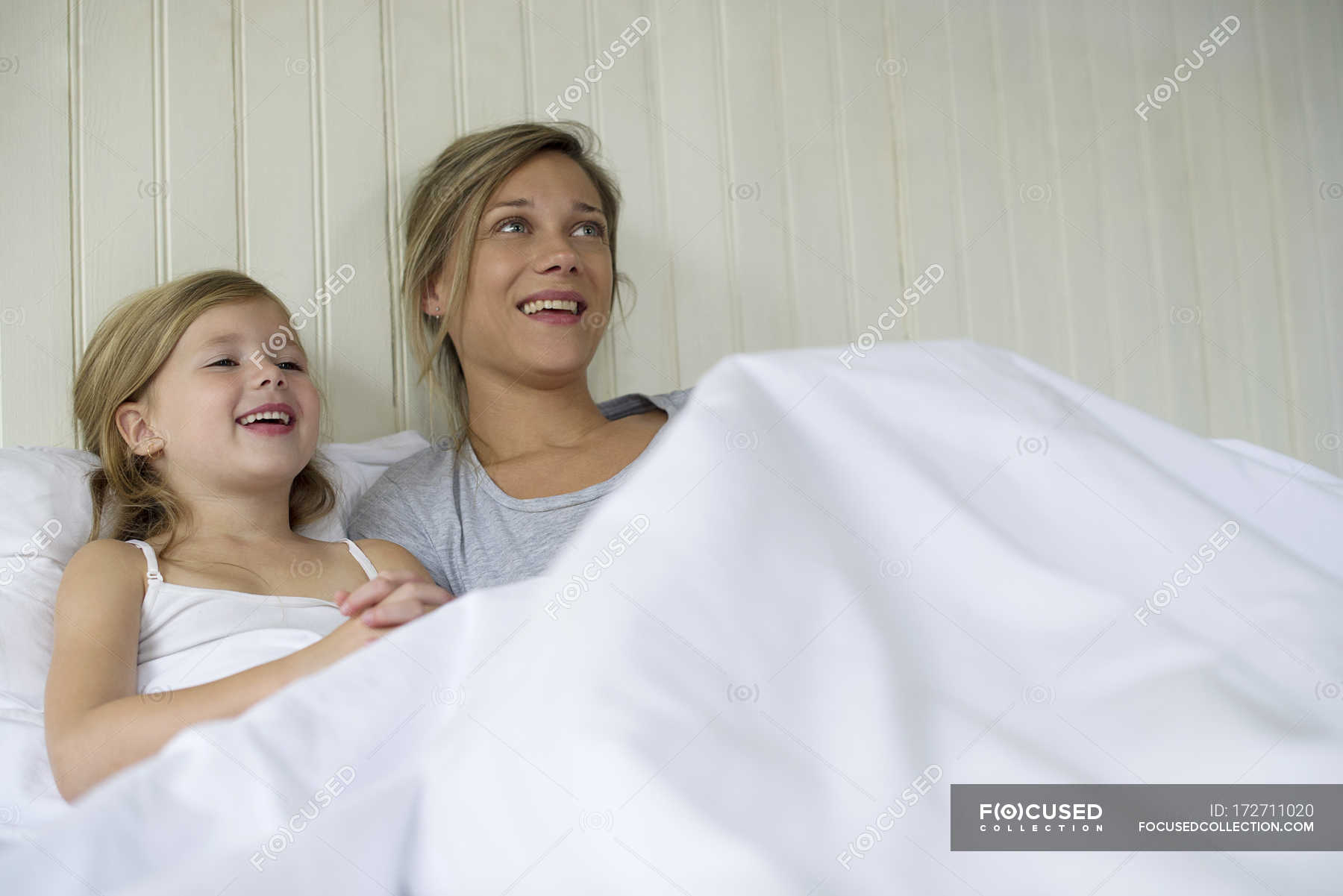 Daughter watches mom