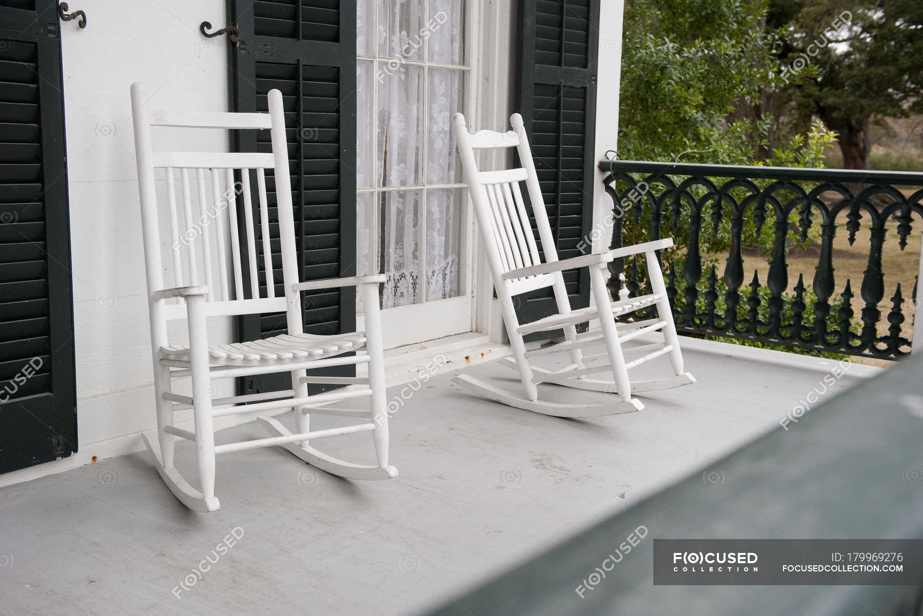 Two Rocking Chairs On Porch Of The House Stock Photo 179969276