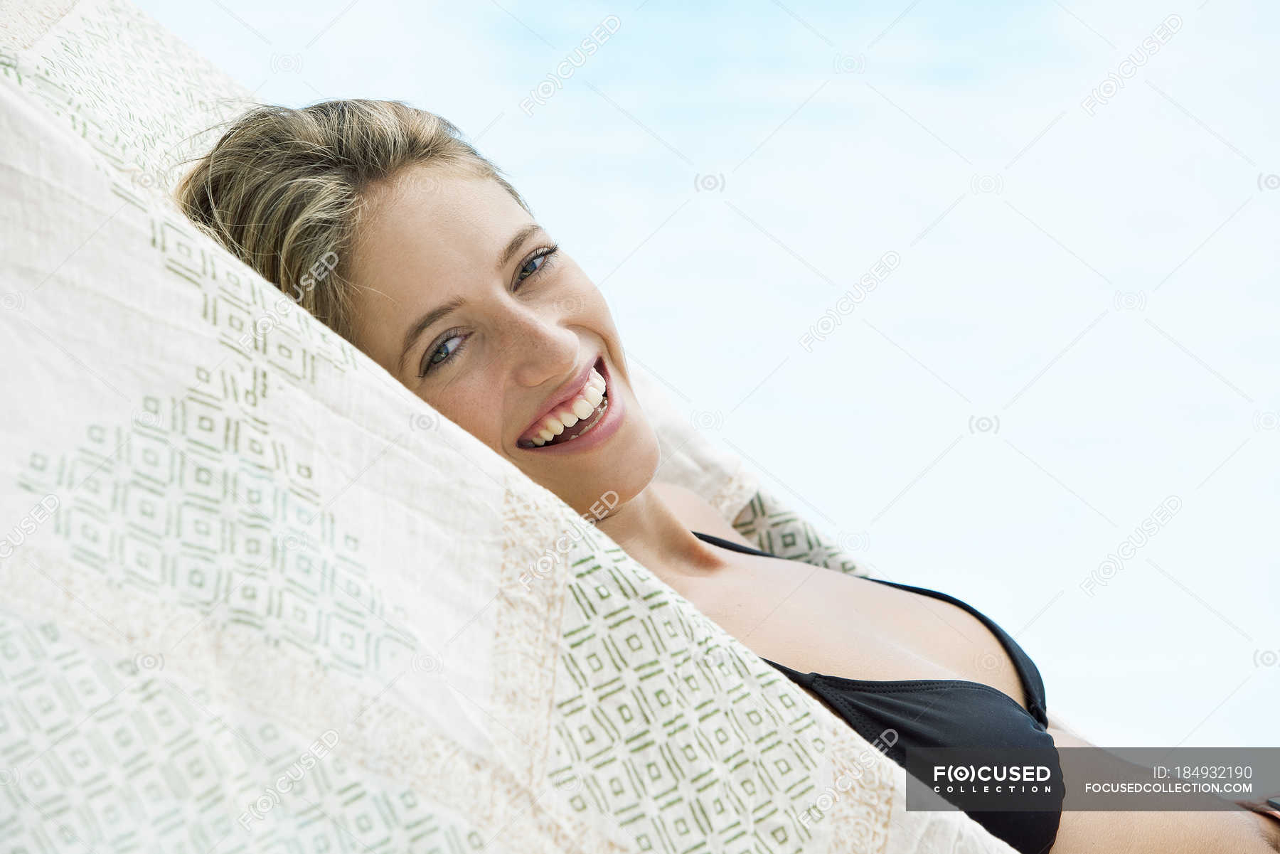 Portrait of Woman sunbathing beside pool — outdoors, relaxation Stock