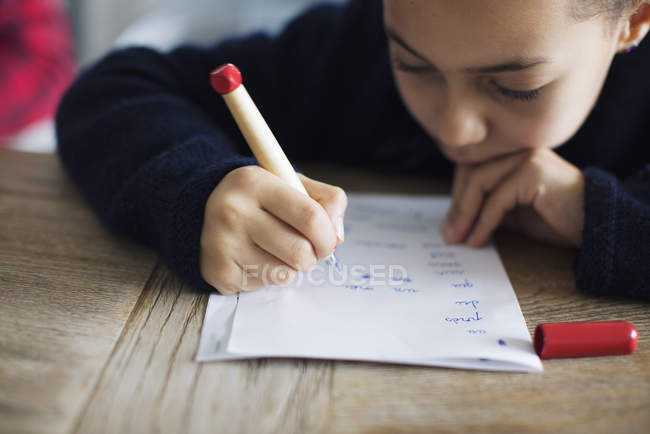 Girl doing homework, close-up — Stock Photo