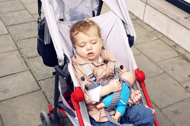 Portrait of cute Toddler sleeping in stroller — Stock Photo