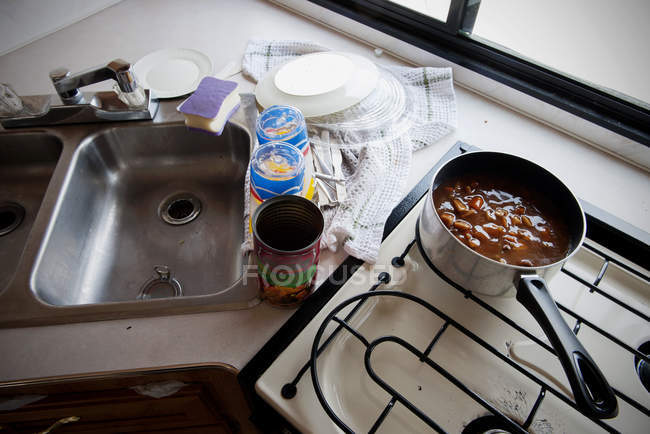 Canned soup cooking on stovetop in motor home — Stock Photo