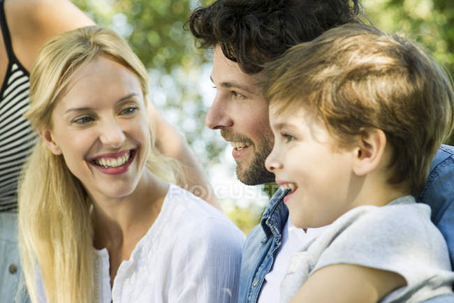 Portrait of family with one child outdoors — Stock Photo