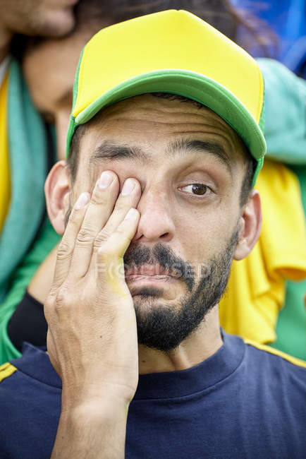 Male football supporter crying at match — Stock Photo