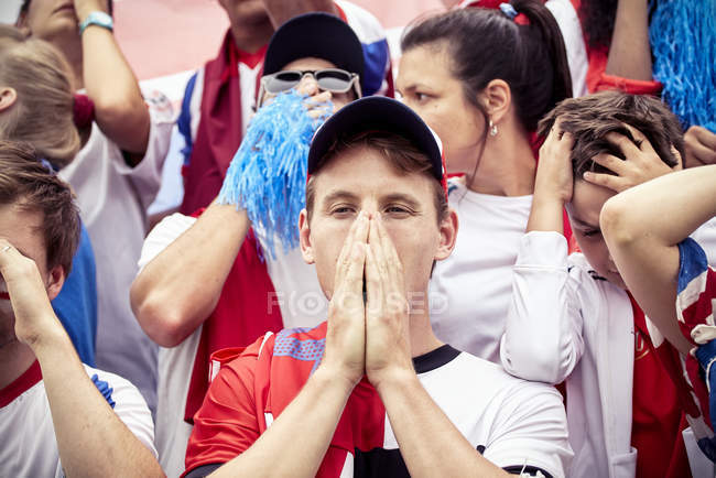 Football fans expressing disappointment at football match — Stock Photo