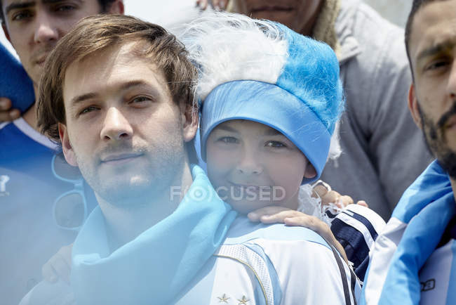 Portrait of father and son at football match — Stock Photo