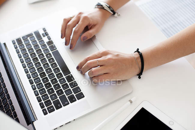 Hands typing on laptop keyboard — Stock Photo