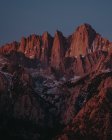 Distant view of Mount Whitney lightened by sunset, Alabama Hills, California, USA — Stock Photo