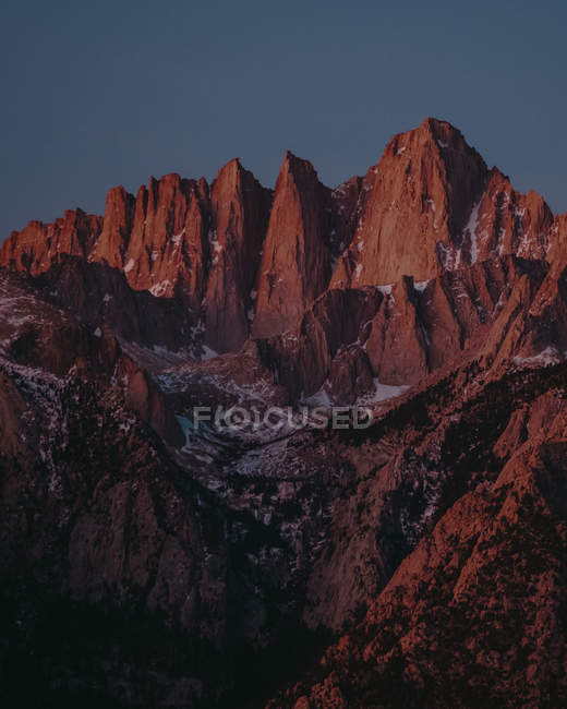 Distant view of Mount Whitney lightened by sunset, Alabama Hills, California, USA — Stock Photo