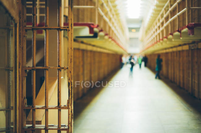 People walking in prison cells — Stock Photo
