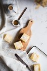 Lemon cake bars and jezve with cofee — Stock Photo