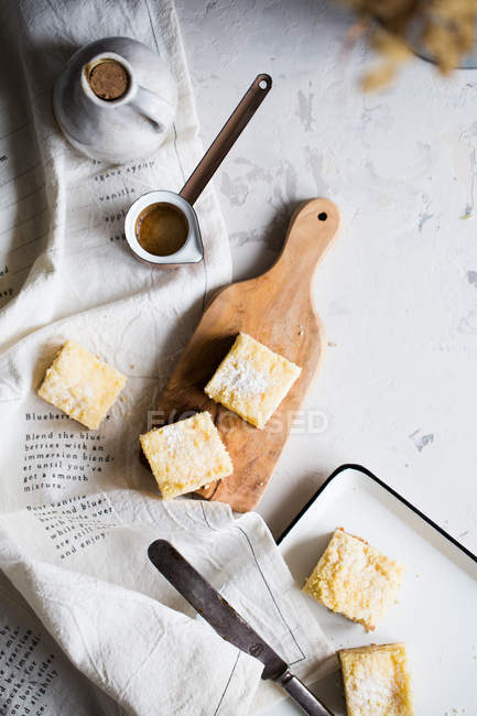 Lemon cake bars and jezve with cofee — Stock Photo