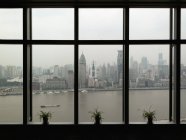 Shanghai skyline seen through wide window — Stock Photo
