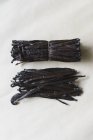 Top view of vanilla pods on white table — Stock Photo